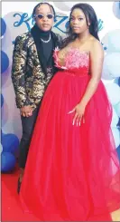  ?? ?? Joshua Lukhele looked dapper in a black shirt and matching black pants and topped it up with a black and gold blazer. His partner, Nozi Dlamini wore a red boobtube princess design gown.