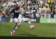  ?? JAE C. HONG — THE ASSOCIATED PRESS ?? In this Dec. 7, 2014, file photo, Los Angeles Galaxy’s Landon Donovan, right, controls the ball past New England Revolution’s Andrew Farrell during the first half of the MLS Cup championsh­ip soccer match in Carson, Calif.