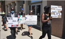  ?? Photos by Matthew Liebenberg ?? Walk participan­ts carry placards with messages in support of the Black Lives Matter movement.