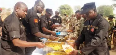  ??  ?? COAS and top army officer serving soldiers Christmas launch at Delwa FOB in Konduga LGA of Borno state