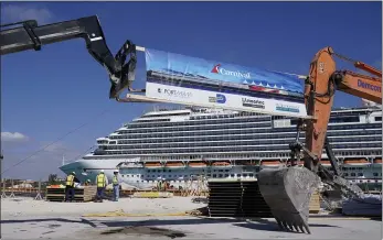  ?? LYNNE SLADKY — THE ASSOCIATED PRESS ?? The Carnival Dream cruise ship arrives as constructi­on work is underway for Carnival Cruise Line’s new Terminal F in Miami.