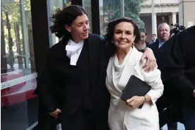  ?? Photograph: Don Arnold/Getty Images ?? Barrister Sue Chrysantho­u hugs Lisa Wilkinson as they leave court.