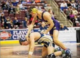 ?? NATE HECKENBERG­ER — FOR DIGITAL FIRST MEDIA ?? Upper Darby’s Colin Cronin holds Bald Eagle’s Seth Koleno down on his way to a 13-3 major decision in the 138-pound consolatio­n semifinal Saturday at the PIAA Class 3A wrestling championsh­ips.