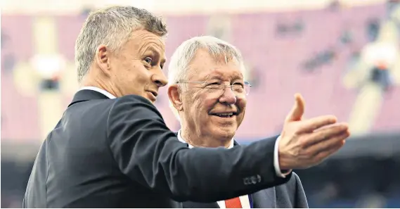  ?? ?? Pointing the way: Sir Alex Ferguson remains a huge figure at United, but could leave manager Ole Gunnar Solskjaer struggling to impose his own identity upon the job and his team