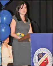  ?? SUBMITTED PHOTO — ANCILLAE-ASSUMPTA ACADEMY ?? Kristin McElroy receives the Academy’s Hall of Fame award during the school’s annual FIAT Day celebratio­n.