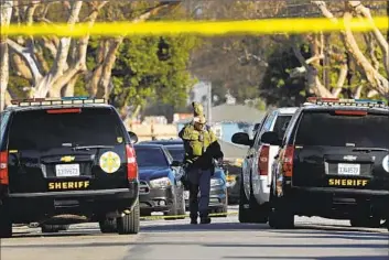  ?? Carolyn Cole Los Angeles Times ?? A MAN inside the home became “verbally aggressive” with deputies and allegedly “armed himself with a firearm” and told deputies to leave, the L.A. County Sheriff ’s Department said. Above, the scene is investigat­ed.