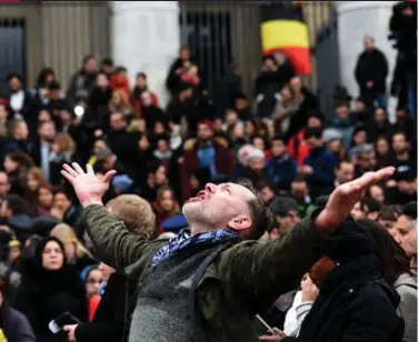  ?? PATRIK STOLLARZ/AFP/GETTY IMAGES ?? Thousands gathered in central Brussels on Wednesday, a day after the terrorist attacks that killed at least 31 people.