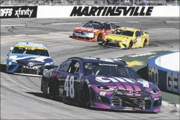  ?? WADE PAYNE/AP ?? ALEX BOWMAN (48) LEADS MARTIN TRUEX JR. (19) during a NASCAR Cup Series auto race Sunday in Martinsvil­le, Va.