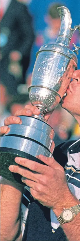  ?? Getty. ?? Nick Faldo plants a kiss on the Claret Jug after his victory at St Andrews 28 years ago.
