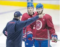  ?? ALLEN McINNIS ?? Canadiens head coach Claude Julien speaks with Brendan Gallagher, left, and Phillip Danault during training camp at the Bell Sports Complex in Brossard on Friday.