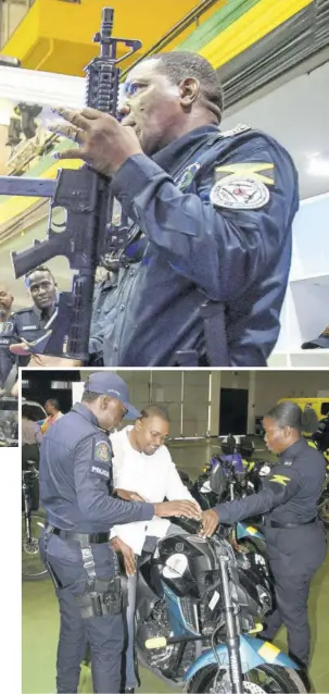  ?? (Photo: JIS) ?? Minister without portfolio in the Office of the Prime Minister, with responsibi­lity for informatio­n, Robert Morgan (centre) tries out a motorcycle while District Constable Brandon Clarke (left) and Woman Constable Lena Watson, of the Metro Quick Response Team, tells him about the features. The minister visited on day two of the inaugural ‘Transforma­tions People, Quality and Technology Expo’ on Friday at the National Arena in Kingston. The four-day event, which highlights the technologi­cal capacity of the force, concluded Sunday.