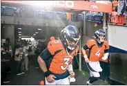  ?? AARON ONTIVEROZ — THE DENVER POST ?? Russell Wilson (3) of the Denver Broncos and Brett Rypien (4) take the field to face the Los Angeles Chargers during the first quarter at Empower Field at Mile High on Sunday, Jan. 8, 2023.