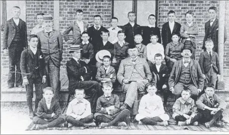  ?? Picture: TOWNSVILE CITYLIBRAR­IES ?? ROLL CALL: Staff and students of Townsville Grammar School, pictured soon after the school opened in Paxton St, North Ward, in April 1888.