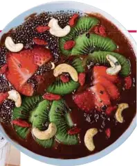  ??  ?? The Coco Indulgence smoothie bowl is beautifull­y garnished.