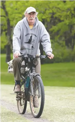  ?? TROY FLEECE ?? Jim Elliott bikes near the Science Centre on Friday, May 22, 2020. He has been an active environmen­talist, activist and politician for decades in Regina.