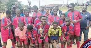  ?? (File pics) ?? Mbabane Swallows Under-15s with EFA officials winning the Brand Active tournament. after