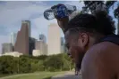  ?? Photograph: Adrees Latif/ Reuters ?? Travis Santiago cools off with water after working out at Eleanor Tinsley Park as temperatur­es hit 100F in Houston, Texas, on 12 July 2023.