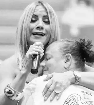  ?? ORLANDO SENTINEL 2017 ?? Singer Melina León goes into the audience to comfort friends and family of Pulse nightclub victims during the 2017 PrideFest Kissimmee at the Kissimmee Civic Center. León will hold a concert Saturday in remembranc­e of the 49 victims and survivors of the Pulse shooting.