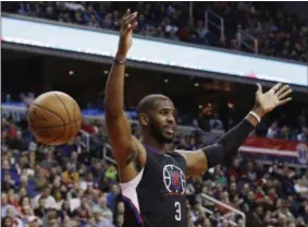  ?? CAROLYN KASTER — THE ASSOCIATED PRESS FILE ?? Guard Chris Paul reacts after dunking the ball during a game against the Washington Wizards in Washington. The Houston Rockets have reached an agreement to trade for Paul according to a person familiar with the deal.