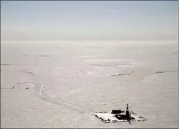  ?? ConocoPhil­lips file photo via AP ?? An explorator­y drilling camp at the proposed site of the Willow oil project is shown in this 2019 aerial photo on Alaska’s North Slope. The Biden administra­tion’s approval of the massive oil developmen­t in northern Alaska on Monday commits the U.S. to yet another decadeslon­g crude project even as scientists urgently warn that only a halt to more fossil fuel emissions can stem climate change.