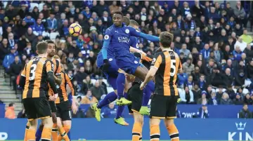  ?? - AFP photo ?? Leicester City’s Nigerian midfielder Wilfred Ndidi (C) scores with this header to make the score 3-1 during the English Premier League football match between Leicester City and Hull City at King Power Stadium in Leicester, central England on March 4,...