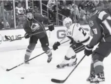  ??  ?? Colorado’s Erik Johnson, left, passes to teammate Rene Bourque in November. Both plan to return to the lineup Saturday. Denver Post file