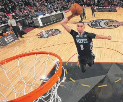  ?? | JESSE D. GARRABRANT/GETTY IMAGES ?? Timberwolv­es guard Zach LaVine successful­ly defended his slam-dunk title Saturday in Toronto.