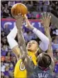  ?? Sue Ogrocki Associated Press ?? KYLE KUZMA of Lakers shoots as Thunder’s Jerami Grant defends.