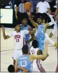  ?? KATHY KMONICEK — AP ?? North Carolina guard R.J. Davis, right, leaps to shoot a basket over UNLV guard Bryce Hamilton on Monday in Asheville, N.C.