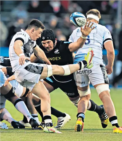  ?? ?? Schemers: Tim Swinson attempts to block Raffi Quirke’s kick for Sale after Saracens utilised their ‘counter-caterpilla­r’ strategy