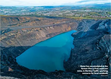  ?? Mark Lewis ?? > Water has accumulate­d at the former Ffos-y-Fran opencast mine, in Merthyr Tydfil, sparking concerns for local residents