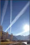  ?? The Washington Post/BONNIE JO MOUNT ?? Contrails stretch above Telluride, Colo., along the San Juan Skyway Scenic Byway, a picturesqu­e road through Colorado.