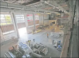  ??  ?? Constructi­on continues on a 10,000-square-foot weight room at the UNLV Fertitta Football Complex, which is scheduled to be completed by October.