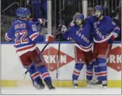  ?? FRANK FRANKLIN II — THE ASSOCIATED PRESS ?? New York Rangers’ Mika Zibanejad (93) and Mats Zuccarello (36) celebrate a Zibanejad goal with teammates during the second period of Game 6of an NHL hockey Stanley Cup second-round playoff series against the Ottawa Senators on Tuesday in New York.