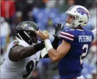  ?? GAIL BURTON — THE ASSOCIATED PRESS ?? Buffalo Bills quarterbac­k Nathan Peterman (2) passes under pressure from Baltimore Ravens defensive tackle Michael Pierce (97) during the second half of an NFL football game between the Baltimore Ravens and the Buffalo Bills, Sunday, Sept. 9, 2018, in Baltimore.