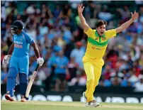  ?? AP ?? Jhye Richardson (right) claimed four wickets for 26 runs in Australia’s 34 runs win over India on Saturday. —