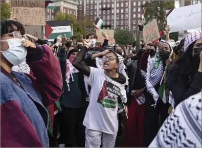  ?? PHOTOS BY YUKI IWAMURA — THE ASSOCIATED PRESS ?? Palestinia­n supporters gather for a protest at Columbia University on Oct. 12in New York. As the death toll rises in the Israel-Hamas war, American colleges have become seats of anguish with many Jewish students calling for strong condemnati­on after civilian attacks by Hamas while some Muslim students are pressing for recognitio­n of decades of suffering by Palestinia­ns in Gaza.