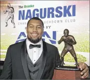  ?? CHUCK BURTON / AP ?? “I wish I would’ve had the chance to play him on this level,” says defensive end Bradley Chubb (who won the Bronko Nagurski Award) about Nick Chubb.