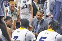  ?? STAFF PHOTO BY ERIN O. SMITH ?? UTC men’s basketball coach Lamont Paris talks with his players during a timeout at the Mocs’ home game against Mercer on Jan. 17. The Mocs have won their past three games, all at McKenzie Arena, to improve to 5-2 in SoCon play. This week they’re on the road, though, for a pair of challengin­g league matchups starting tonight at.