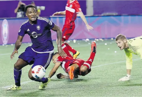  ?? STEPHEN M. DOWELL/ORLANDO SENTINEL VIA THE ASSOCIATED PRESS ?? Orlando City SC’s Cyle Larin, left, has scored a goal in each of his side’s first three games in this year’s MLS season.