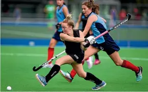  ?? DAVID UNWIN/STUFF ?? College player Alice Little takes a shot at goal in their match against Palmerston North Girls’ High School.