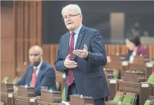  ?? ADRIAN WYLD THE CANADIAN PRESS ?? Federal Transport Minister Marc Garneau is expanding the required use of face coverings on planes, trains, ships and transit to reduce the risk of COVID-19.