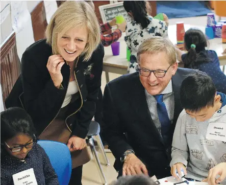  ?? KERIANNE SPROULE ?? Premier Rachel Notley and Education Minister David Eggen mingle with students at Connaught School in Calgary on Friday. The two were at the inner-city school to highlight Alberta’s $75-million classroom improvemen­t fund.