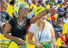  ?? Picture: SIMPHIWE NKWALI ?? PARTY COLOURS: ANC supporters in a joyous mood ahead of the governing party’s manifesto launch at Nelson Mandela Bay Stadium yesterday