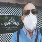  ??  ?? Peter Stanleigh, wearing a mandatory face mask, says life in China today is one of social isolation and patience.