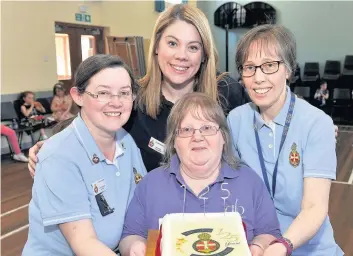  ??  ?? Pictured with birthday cake is Yvonne Gallacher, Carol King, Suzanne Bennie and Hazel Brynes