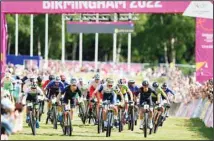  ?? ?? A view of the start of the Men’s Mountain Bike Cross-Country final at Cannock Chase on day six of the 2022 Commonweal­th Games, in Cannock, England. (AP)