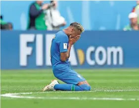  ??  ?? Brazil’s Neymar kneels on the pitch after scoring against Costa Rica on Friday in St. Petersburg, Russia. PETR DAVID JOSEK/AP