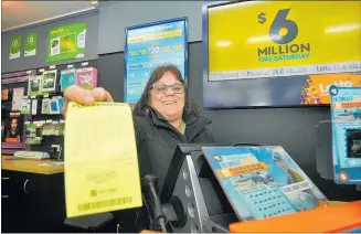  ?? PHOTO: CLINTON
LLEWELLYN ?? Donna Barr, who has worked at Paper Plus Waipukurau for five years, said selling the winning $333,333 ticket made her feel almost like she had won Lotto herself — “but not quite”.