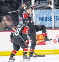  ?? VINCENT ETHIER • QMJHL ?? Halifax Mooseheads winger Raphael Lavoie celebrates his overtime winner with Xavier Simoneau in Team QMJHL's 4-3 victory over Russia in Moncton on Tuesday.